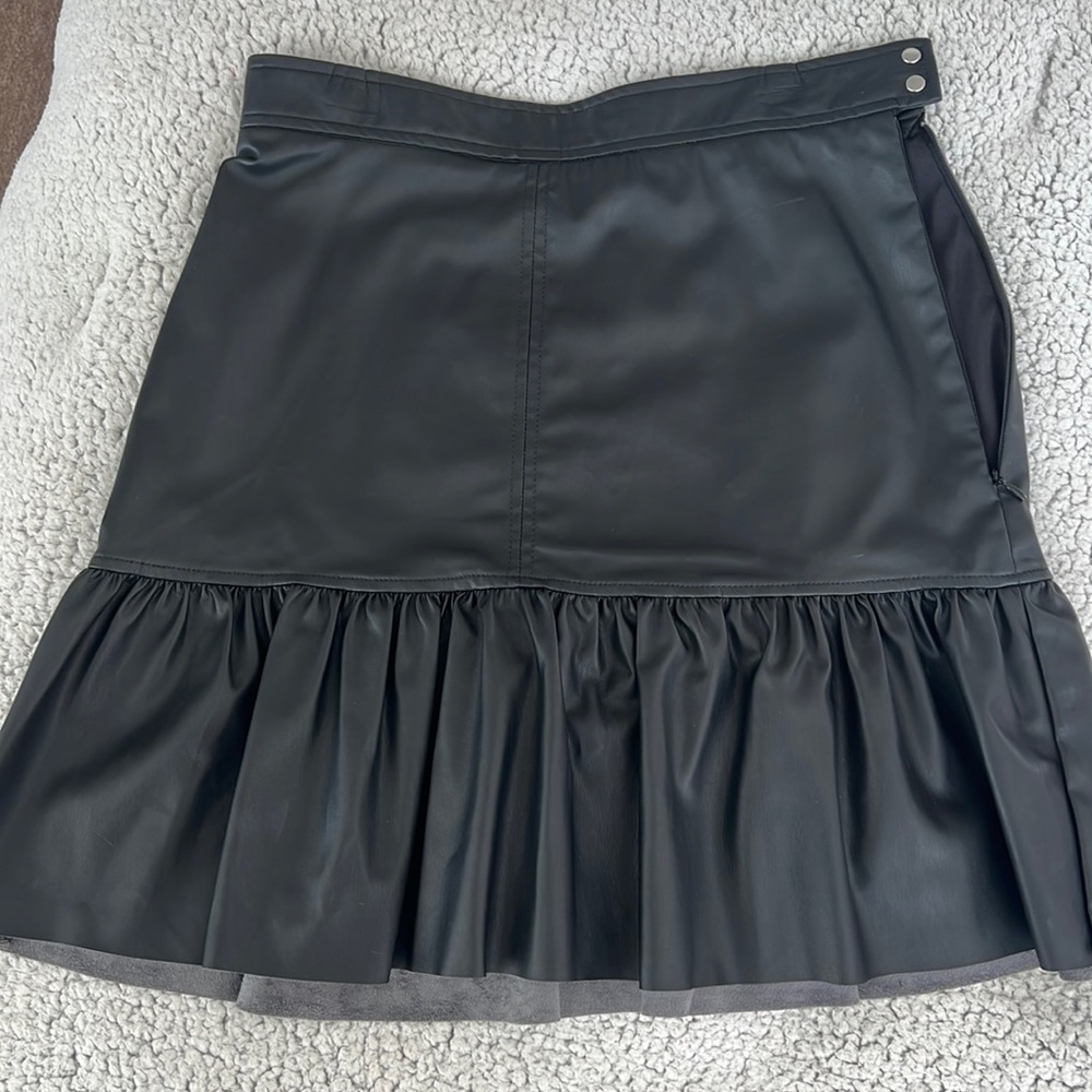 Black faux leather mini skirt with ruffle